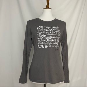 Gently used Long sleeve "love multilanguage" Shirt with white lettering sz xs